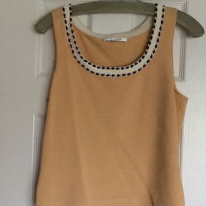 Three piece skirt, tank and jacket set.